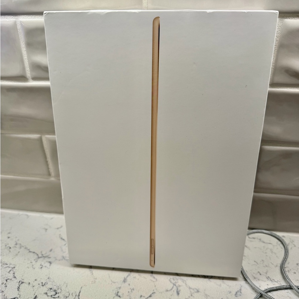 Apple 12.9” iPad Pro 128 GB (2nd Generation) Tablet in Gold comes with 2 cases.